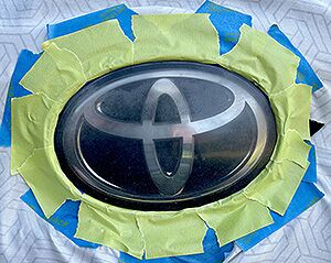 before toyota emblem restoration – hazy logo