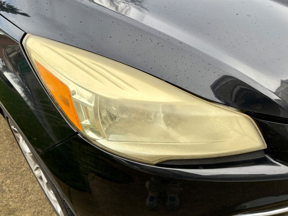 ford escape headlight before large